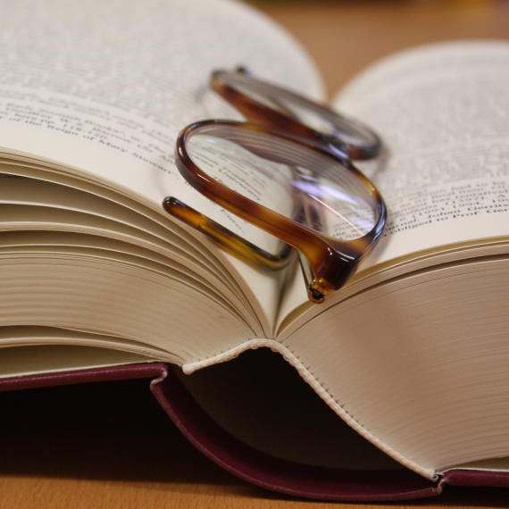 Glasses lying on an open book